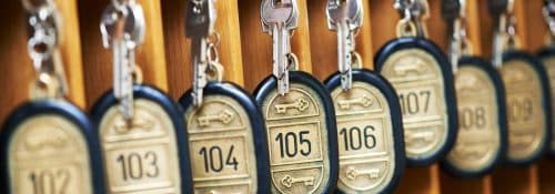 Hotel reception with room keys representing property management systems data